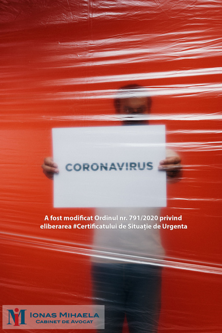 man-holding-a-coronavirus-sign-behind-a-plastic-3952196.jpg